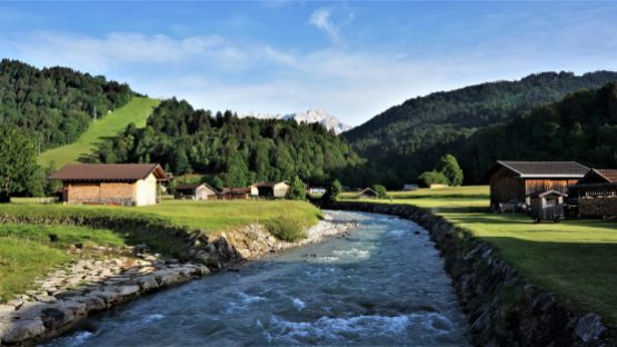 Clean snow melt fills the Loisach river